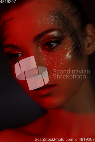 Image of beautiful blond girl with sparkling makeup