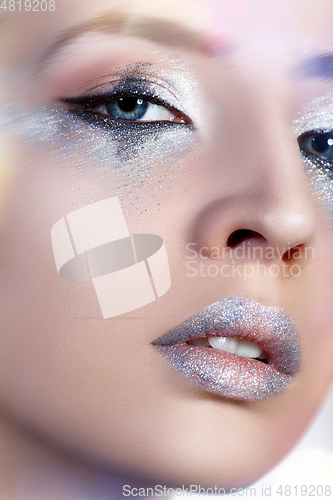 Image of beautiful blond girl with sparkling makeup