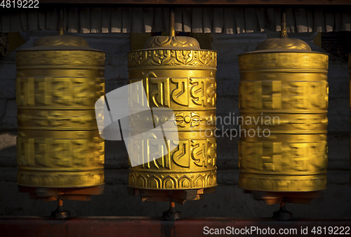 Image of Rotating buddhist prayer wheels as symbol of buddhism religion