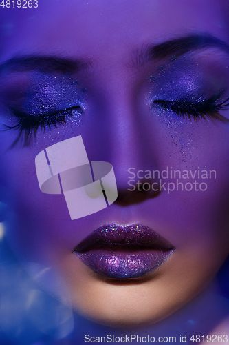 Image of beautiful blond girl with sparkling makeup