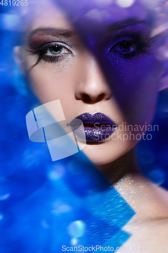 Image of beautiful blond girl with sparkling makeup