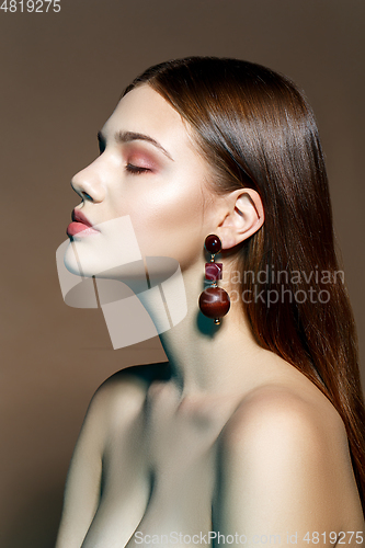 Image of beautiful girl with natural makeup and long hair