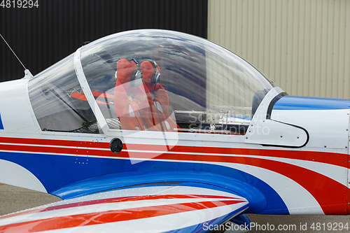 Image of small plane standing in shed