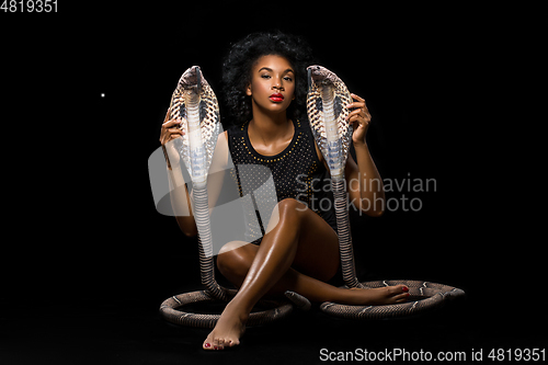 Image of beautiful girl with snakes