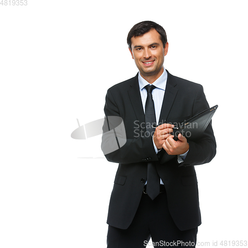 Image of handsome businessman in suit with tablet