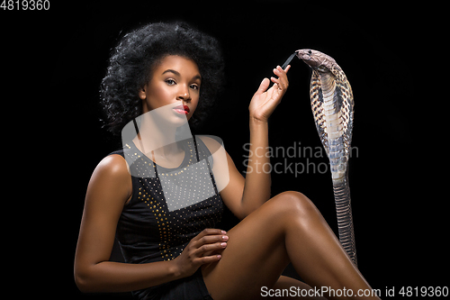 Image of beautiful girl with snake