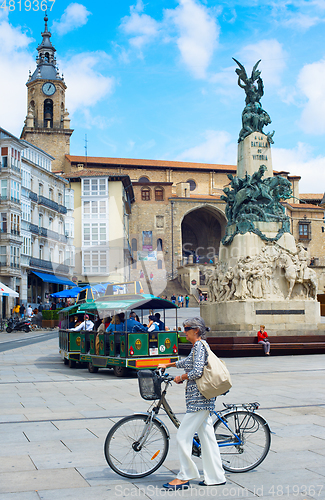 Image of Senior elegant woman with bicycle