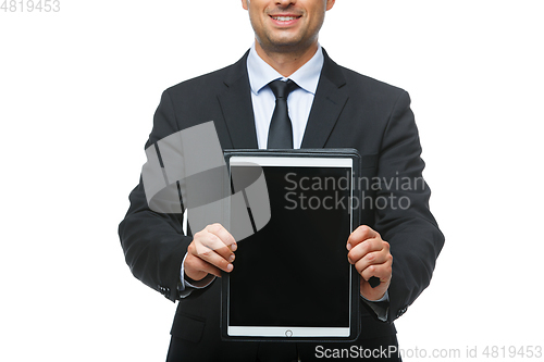 Image of handsome businessman in suit with tablet