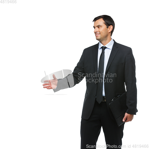 Image of handsome businessman in suit with tablet