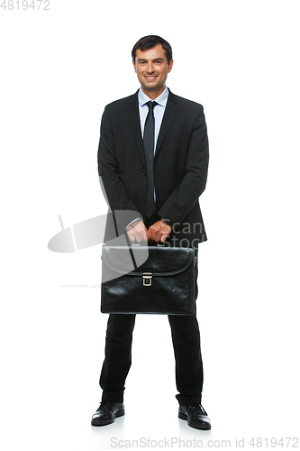 Image of handsome businessman in suit with briefcase