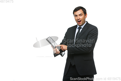 Image of handsome businessman in suit with tablet