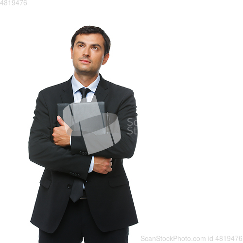 Image of handsome businessman in suit with tablet