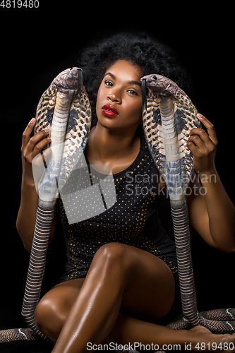 Image of beautiful girl with snakes