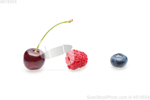 Image of blueberry, cherry and raspberry berries isolated on white background