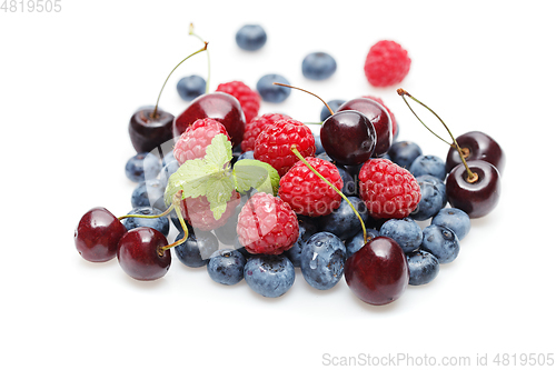 Image of blueberry, cherry and raspberry berries isolated on white background