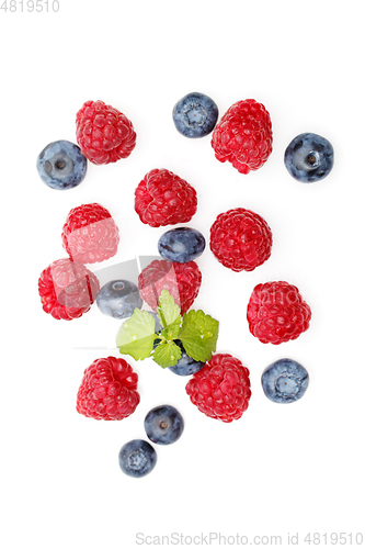 Image of blueberry and raspberry berries isolated on white background