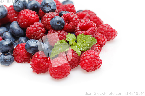 Image of blueberry and raspberry berries isolated on white background