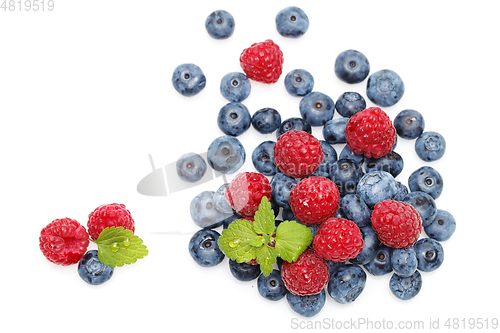 Image of blueberry and raspberry berries isolated on white background