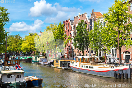 Image of Amsterdam canals and  boats, Holland, Netherlands.
