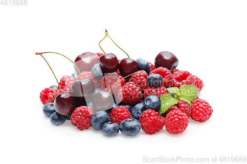 Image of blueberry, cherry and raspberry berries isolated on white background