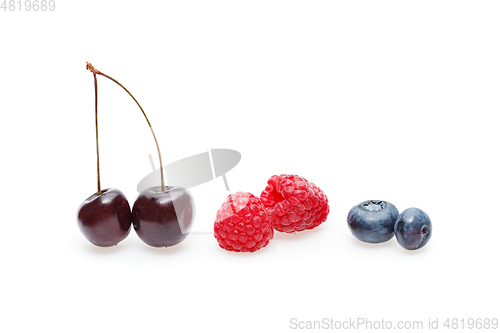 Image of blueberry, cherry and raspberry berries isolated on white background