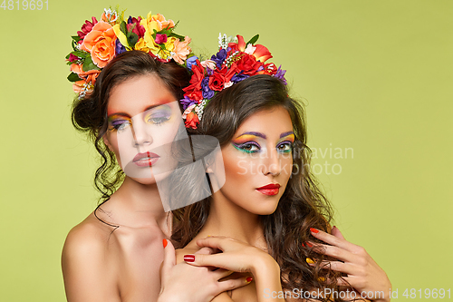 Image of beautiful girls with flower accessories