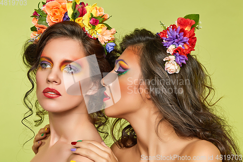 Image of beautiful girls with flower accessories