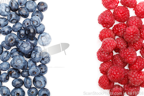 Image of blueberry and raspberry berries isolated on white background