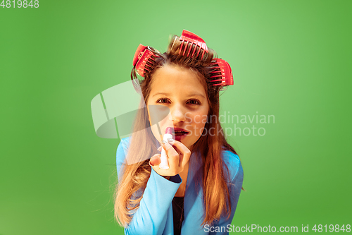Image of Teen girl dreaming about future profession of makeup artist