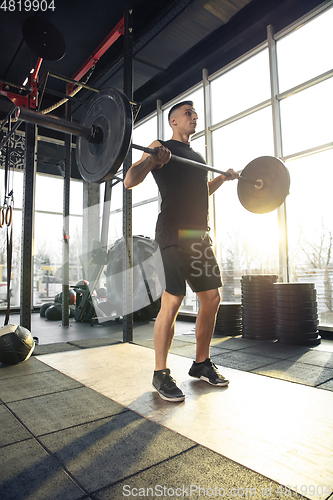 Image of The male athlete training hard in the gym. Fitness and healthy life concept.