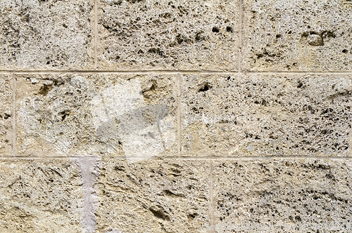 Image of cavernous stone wall detail