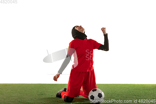 Image of Arabian female soccer or football player isolated on white studio background