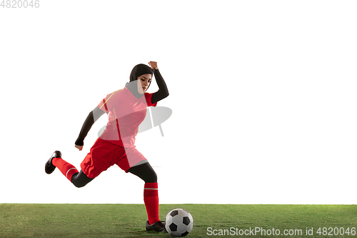 Image of Arabian female soccer or football player isolated on white studio background