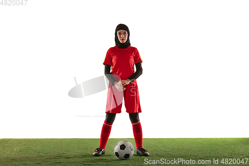 Image of Arabian female soccer or football player isolated on white studio background