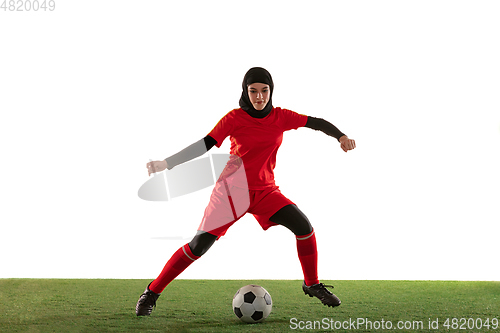 Image of Arabian female soccer or football player isolated on white studio background