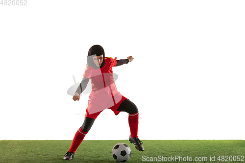 Image of Arabian female soccer or football player isolated on white studio background