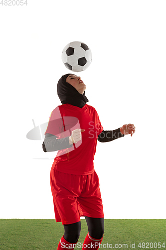 Image of Arabian female soccer or football player isolated on white studio background