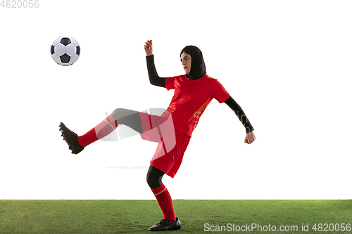 Image of Arabian female soccer or football player isolated on white studio background