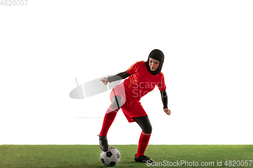 Image of Arabian female soccer or football player isolated on white studio background