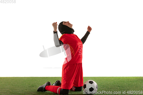 Image of Arabian female soccer or football player isolated on white studio background