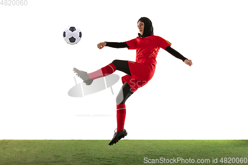 Image of Arabian female soccer or football player isolated on white studio background