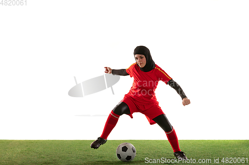 Image of Arabian female soccer or football player isolated on white studio background