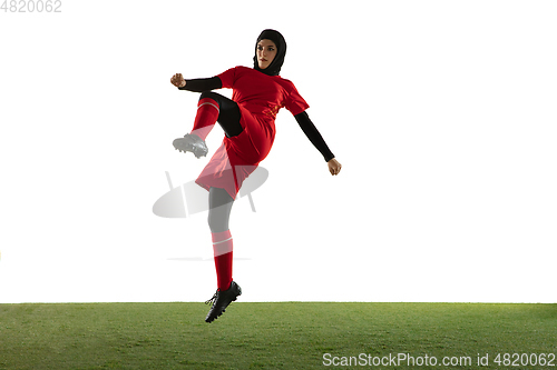 Image of Arabian female soccer or football player isolated on white studio background