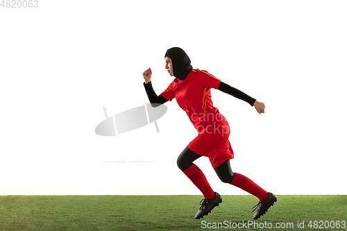 Image of Arabian female soccer or football player isolated on white studio background