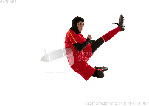 Image of Arabian female soccer or football player isolated on white studio background