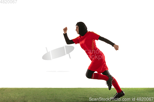 Image of Arabian female soccer or football player isolated on white studio background