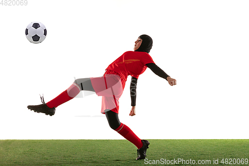 Image of Arabian female soccer or football player isolated on white studio background