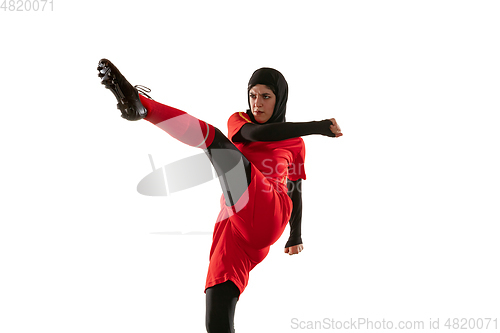 Image of Arabian female soccer or football player isolated on white studio background