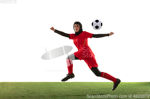 Image of Arabian female soccer or football player isolated on white studio background