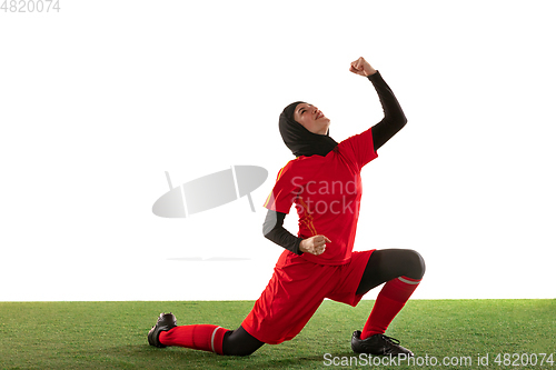 Image of Arabian female soccer or football player isolated on white studio background